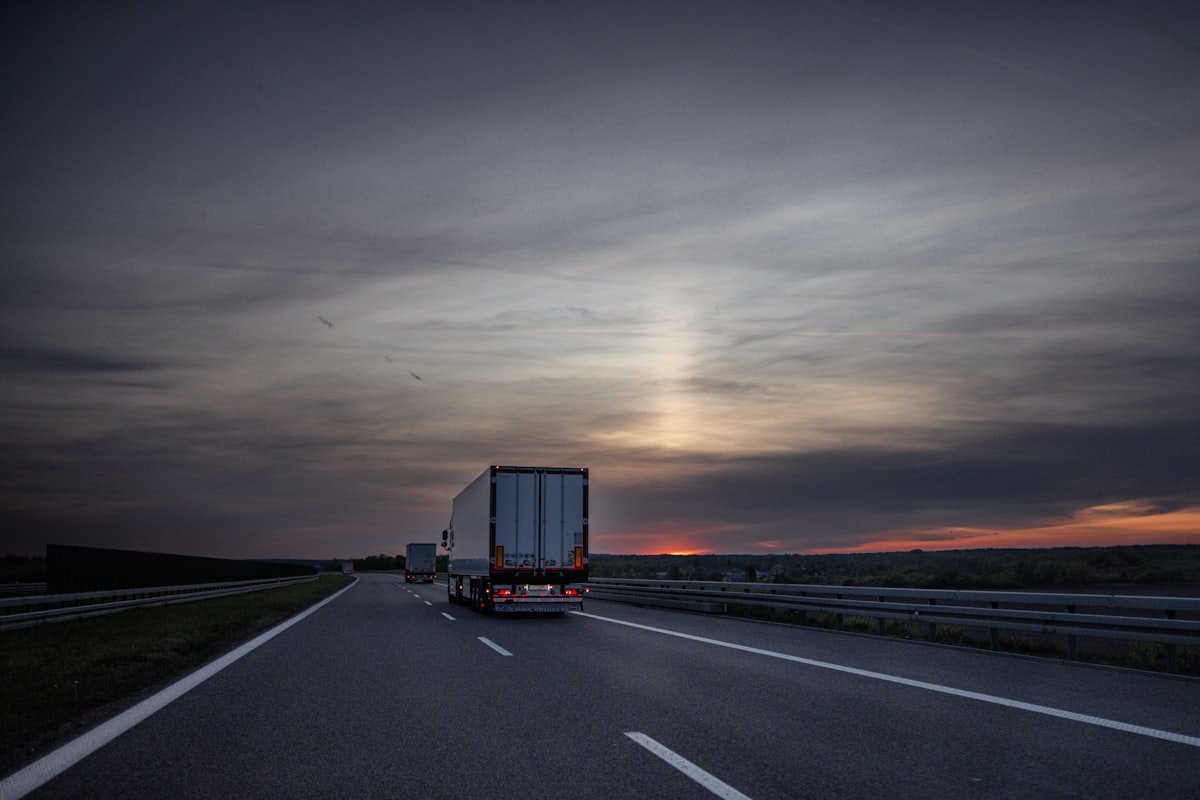 Delivery truck on the highway at sunset